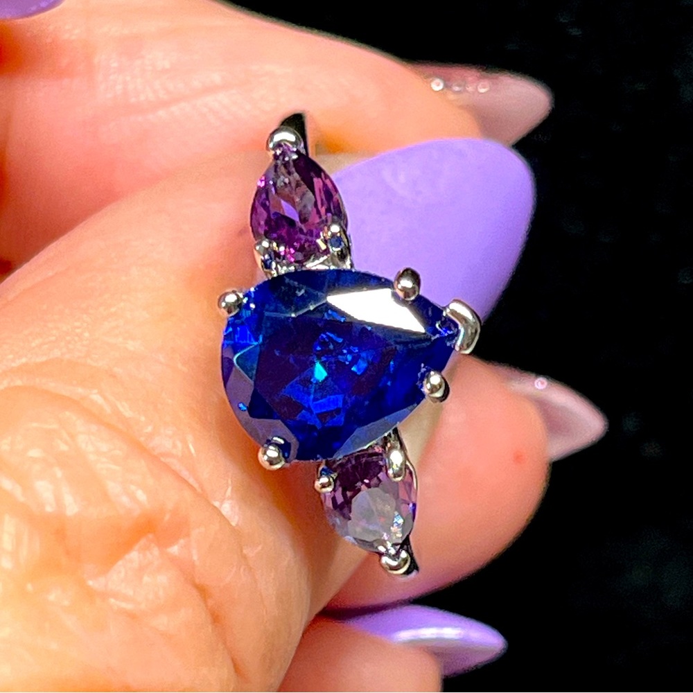 Ladies blue pear shaped evening ring on sterling with purple accent stones